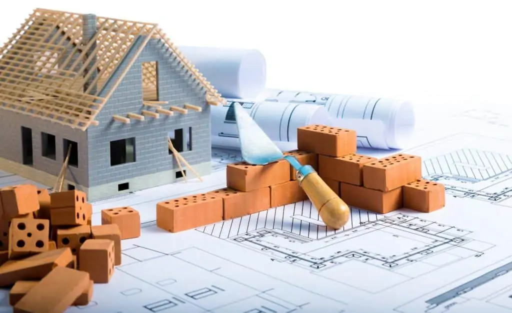 Model Home Sitting on Blueprints