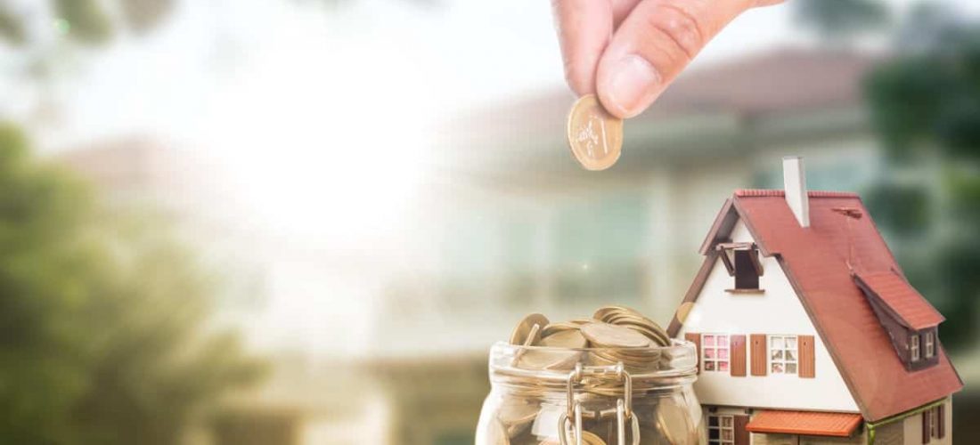 Homeowner putting coin into jar