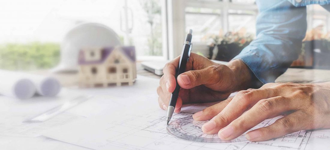 Hands of Engineer working on blueprint,Construction concept. Engineering tools.Vintage tone retro filter effect,soft focus(selective focus)